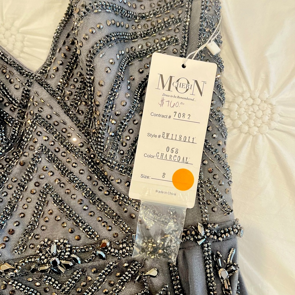 Beautiful charcoal and silver dress never been used.